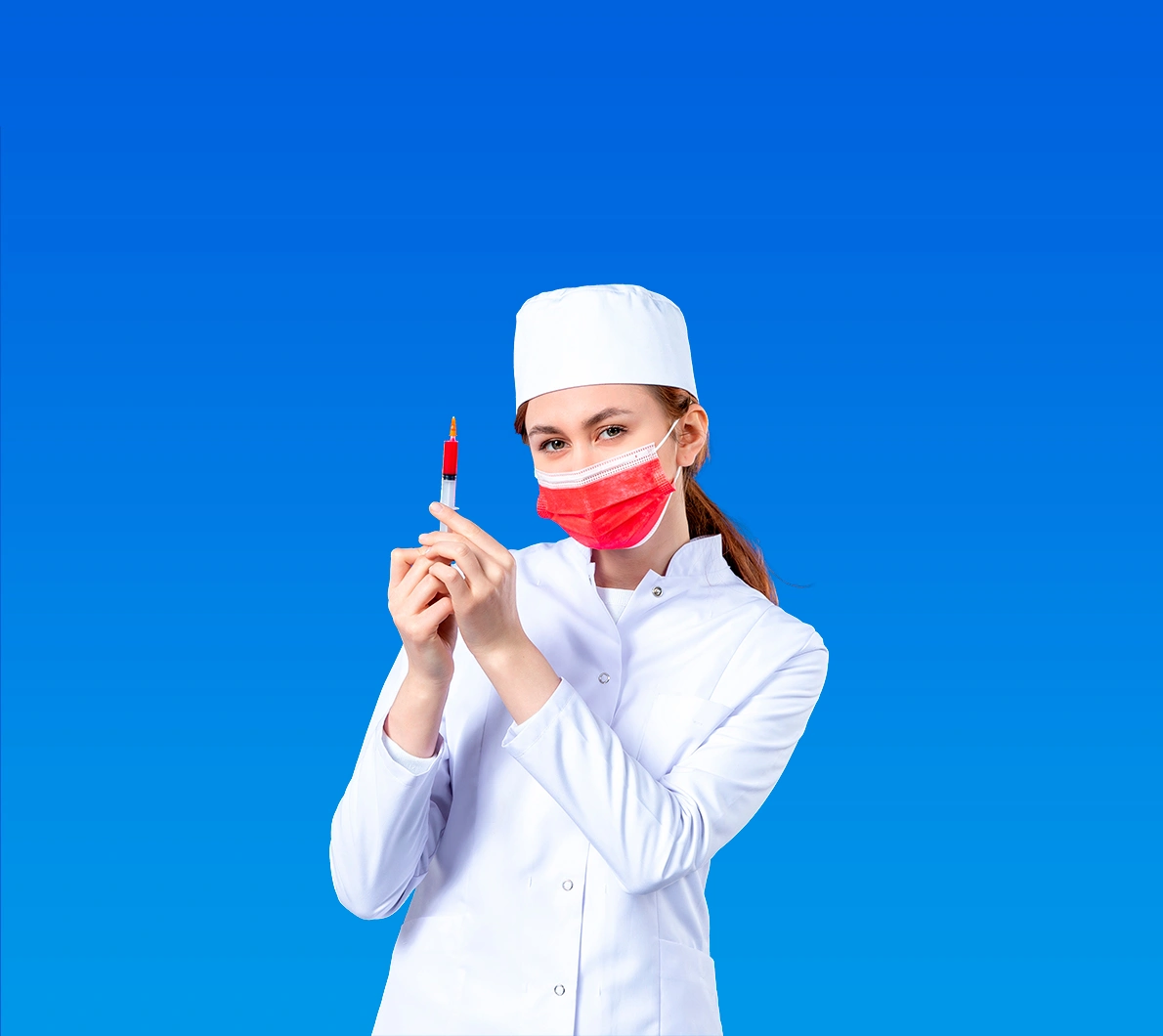 female nurse in white medical suit with red mask and injection in her hands on blue